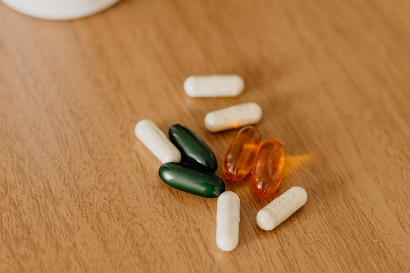 Supplement capsules on a table, not to be confused with a solid food foundation