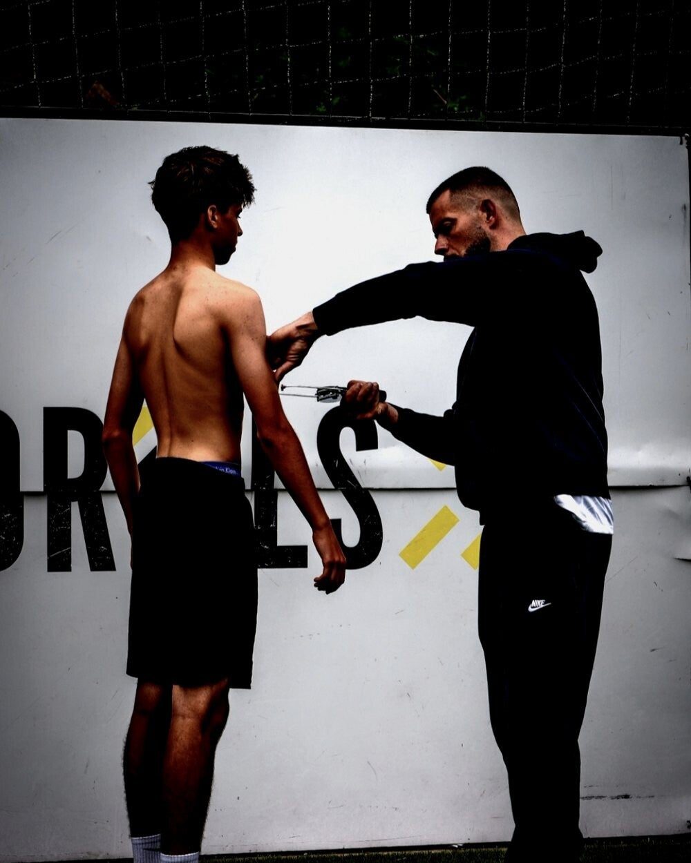 Jérôme Devos measures the skinfolds of a young footballer