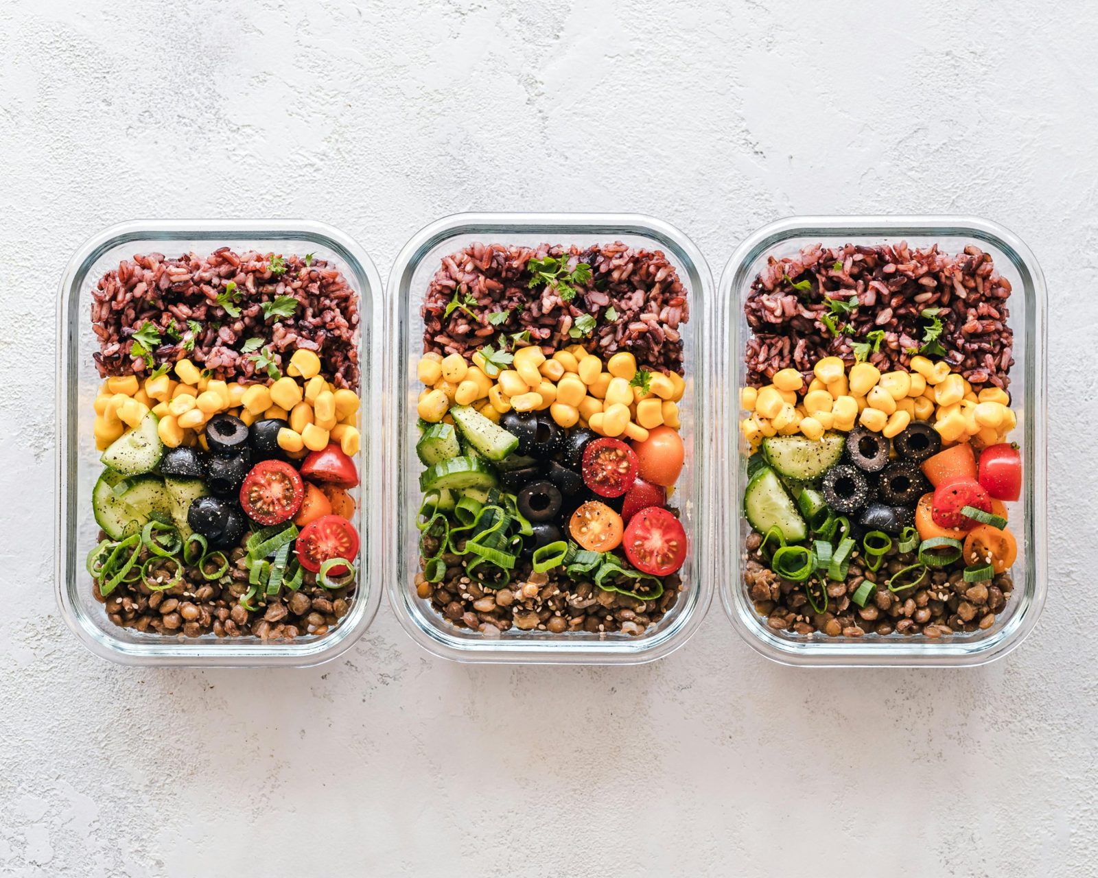 Meals prepared in advance, rice, pulses and vegetables to cover a young footballer's calorie needs
